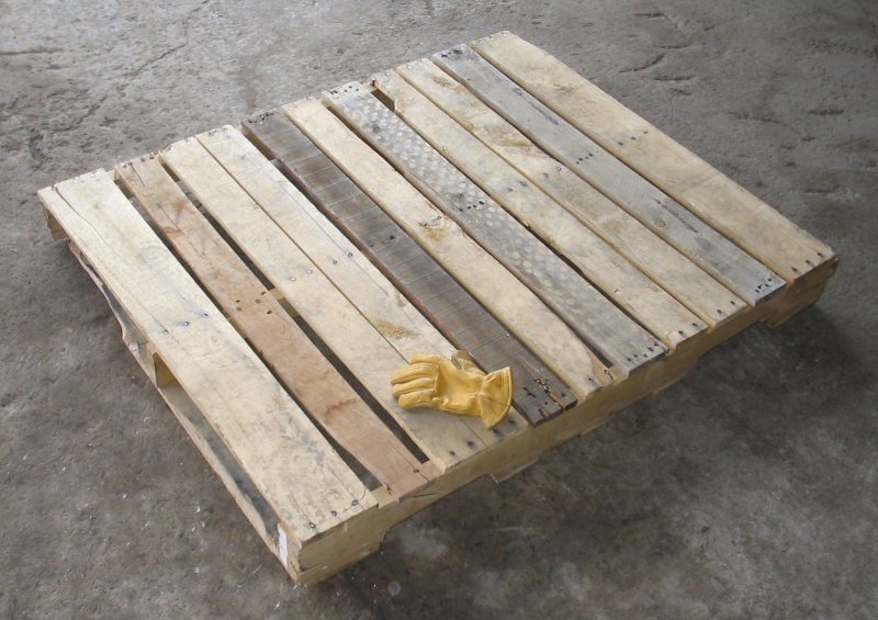 Wooden pallet with glove